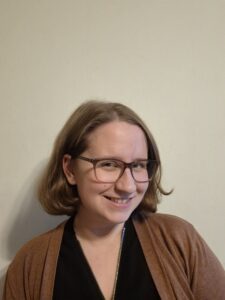 a woman who smiles at the camera.