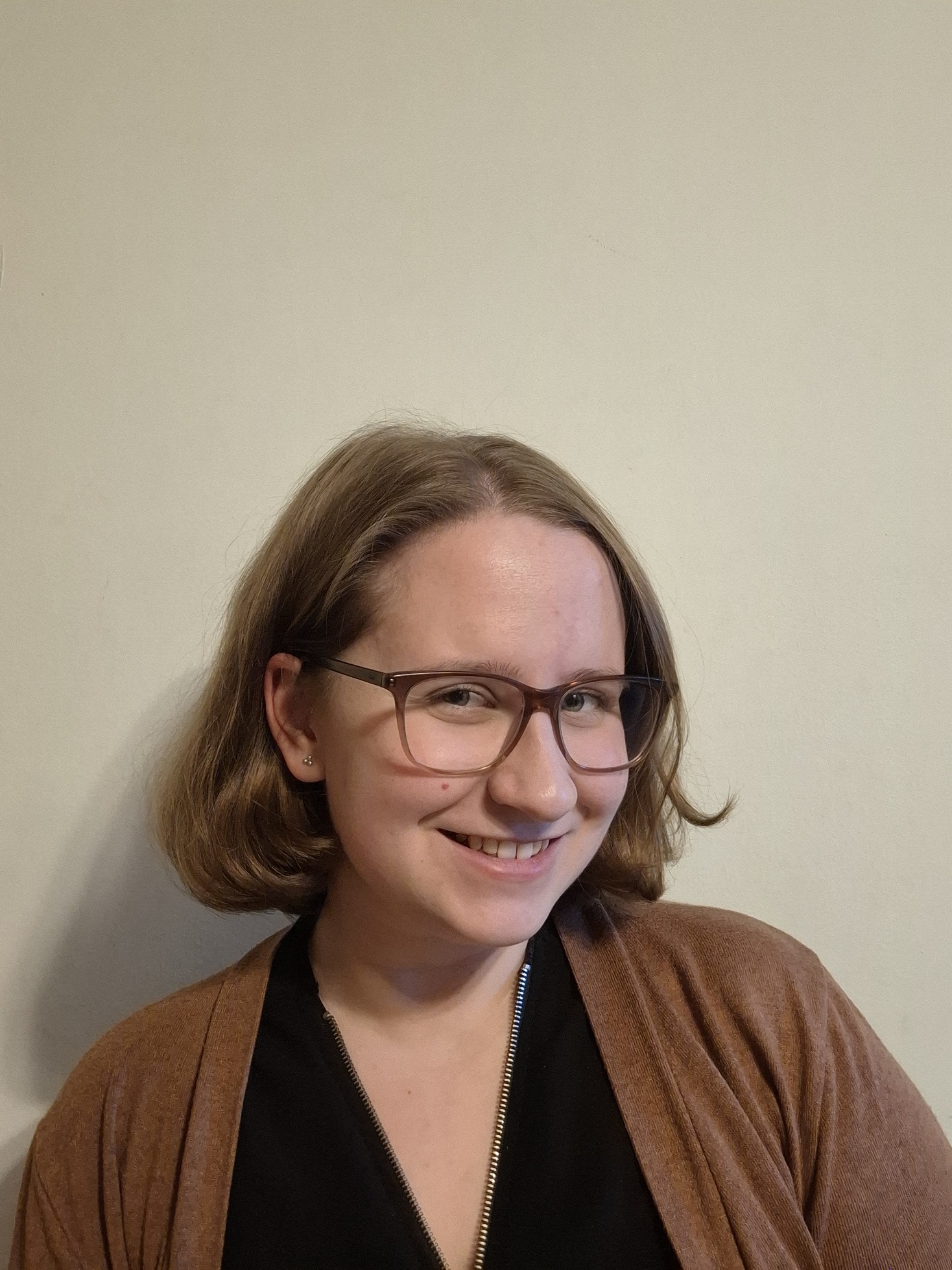 a woman who smiles at the camera.